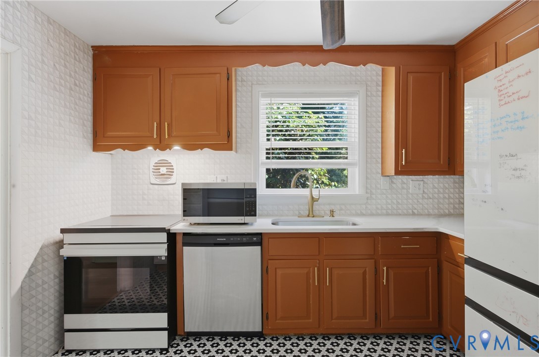 8210 Ireton Road Henrico, VA 23228 - Photo 10 of 36 a kitchen with stainless steel appliances a sink stove and cabinets