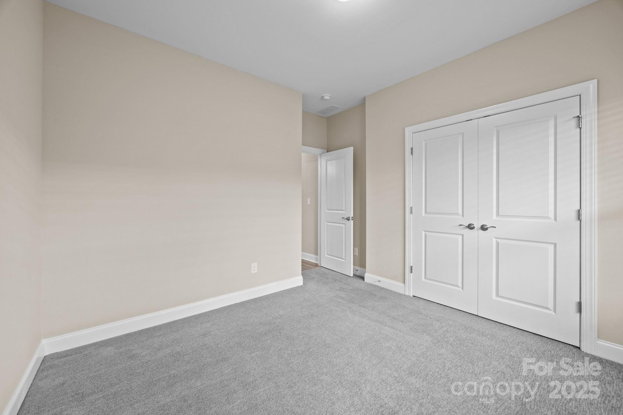 5240 Birchhill Road Mint Hill, NC 28227 - Photo 16 of 48 a view of an empty room and closet area