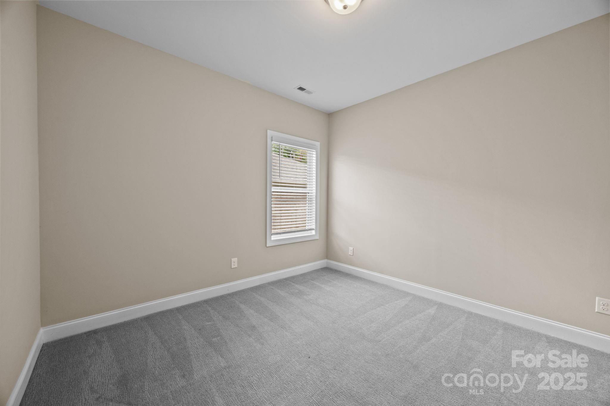 5240 Birchhill Road Mint Hill, NC 28227 - Photo 19 of 48 a view of an empty room with a window