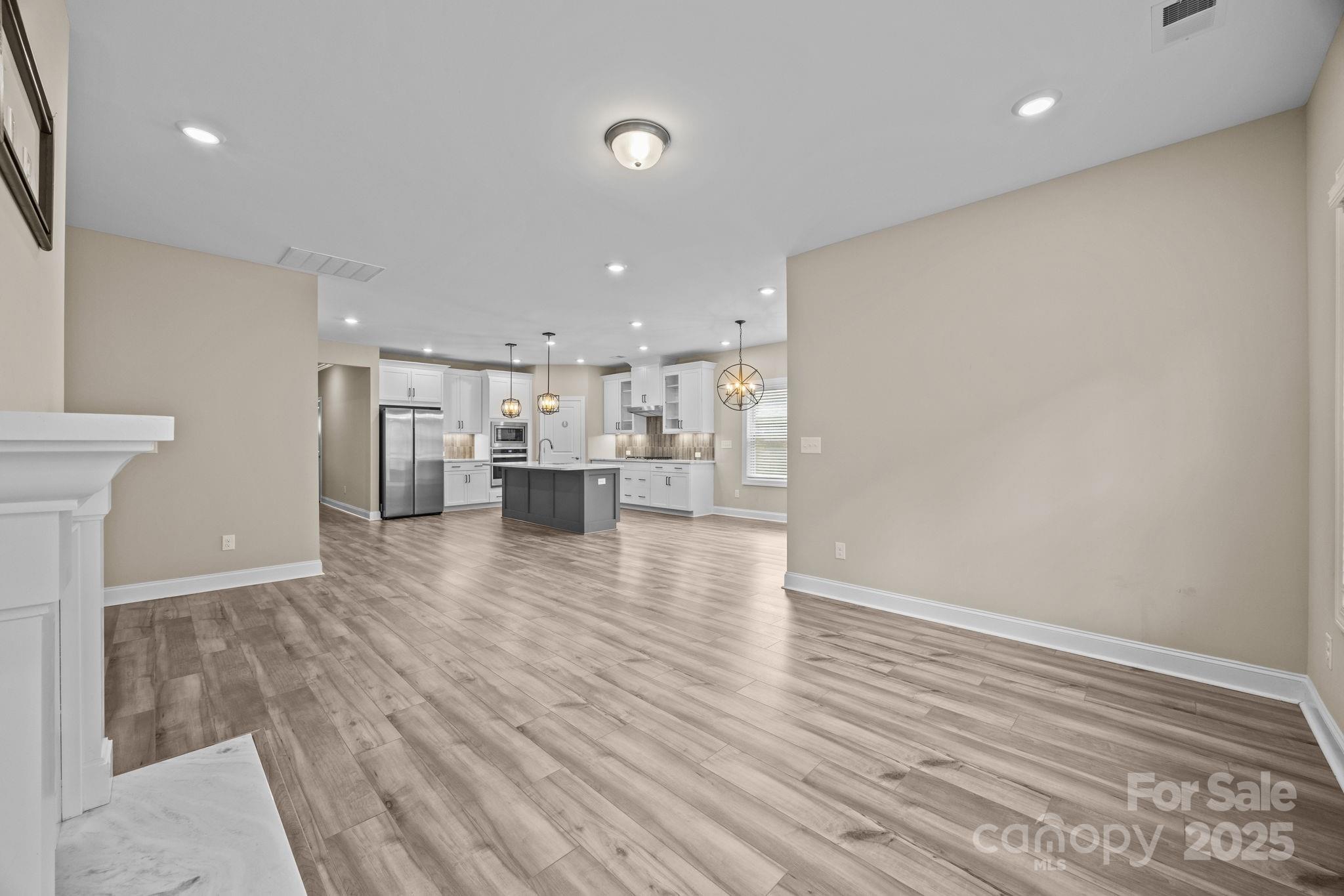 5240 Birchhill Road Mint Hill, NC 28227 - Photo 34 of 48 a view of kitchen island wooden floor