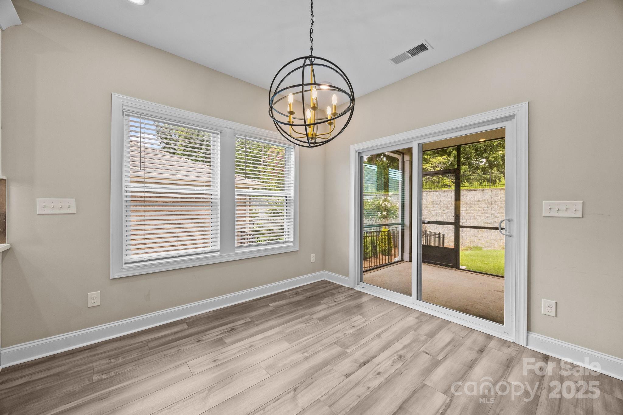 5240 Birchhill Road Mint Hill, NC 28227 - Photo 37 of 48 a view of an empty room with wooden floor and a window