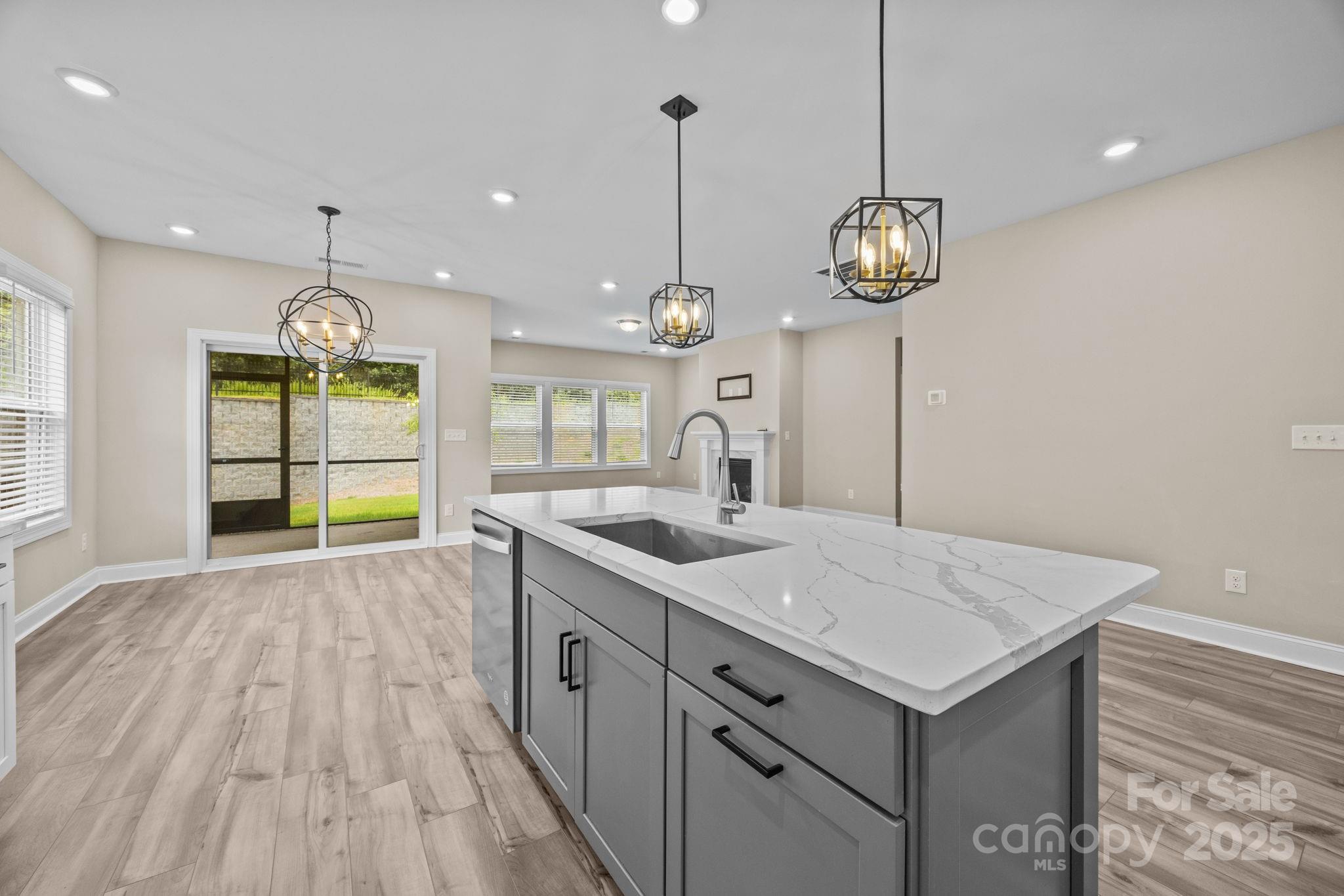 5240 Birchhill Road Mint Hill, NC 28227 - Photo 40 of 48 a kitchen with a table and chandelier