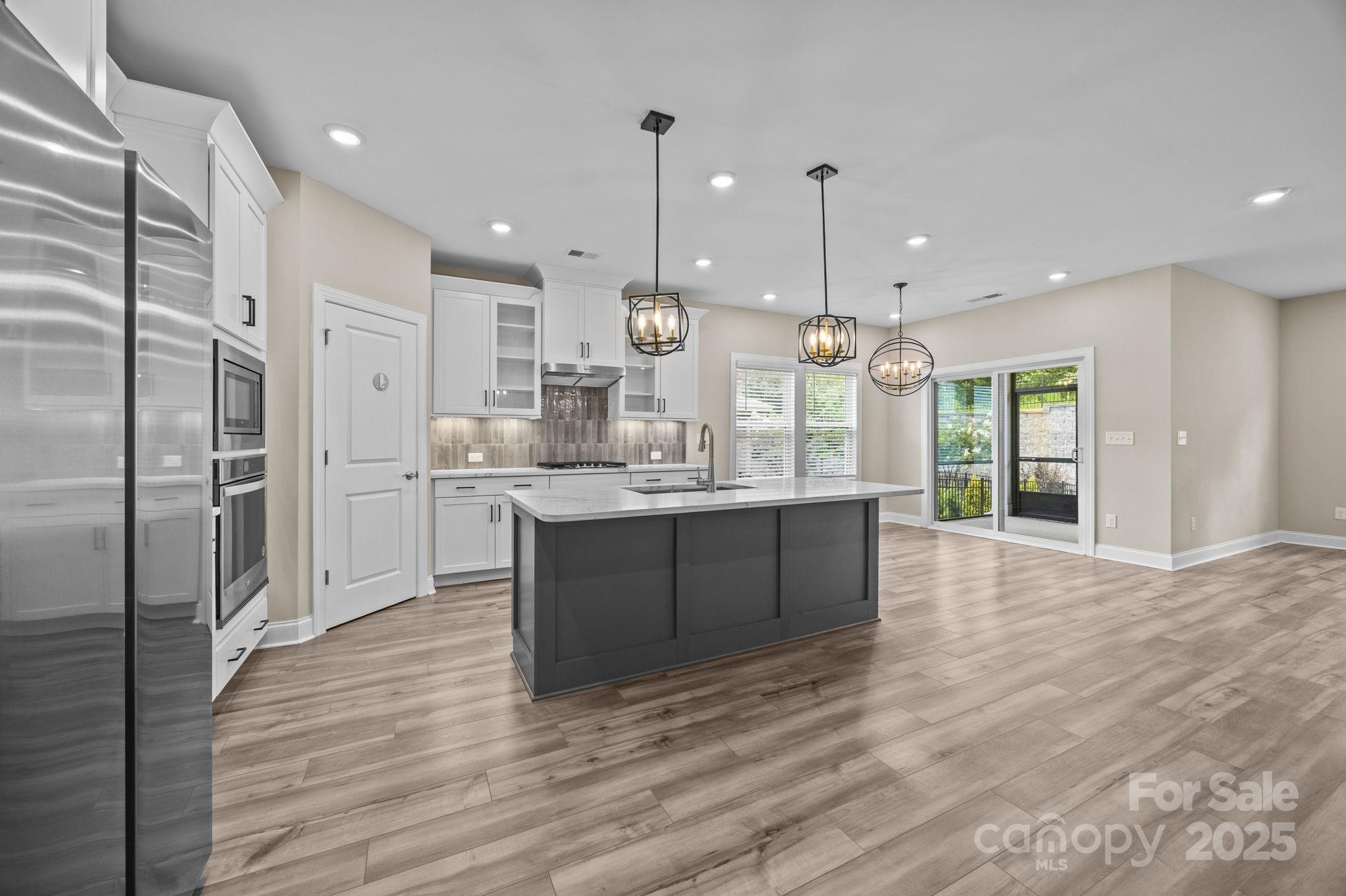 5240 Birchhill Road Mint Hill, NC 28227 - Photo 41 of 48 a large kitchen with kitchen island a sink stainless steel appliances and cabinets