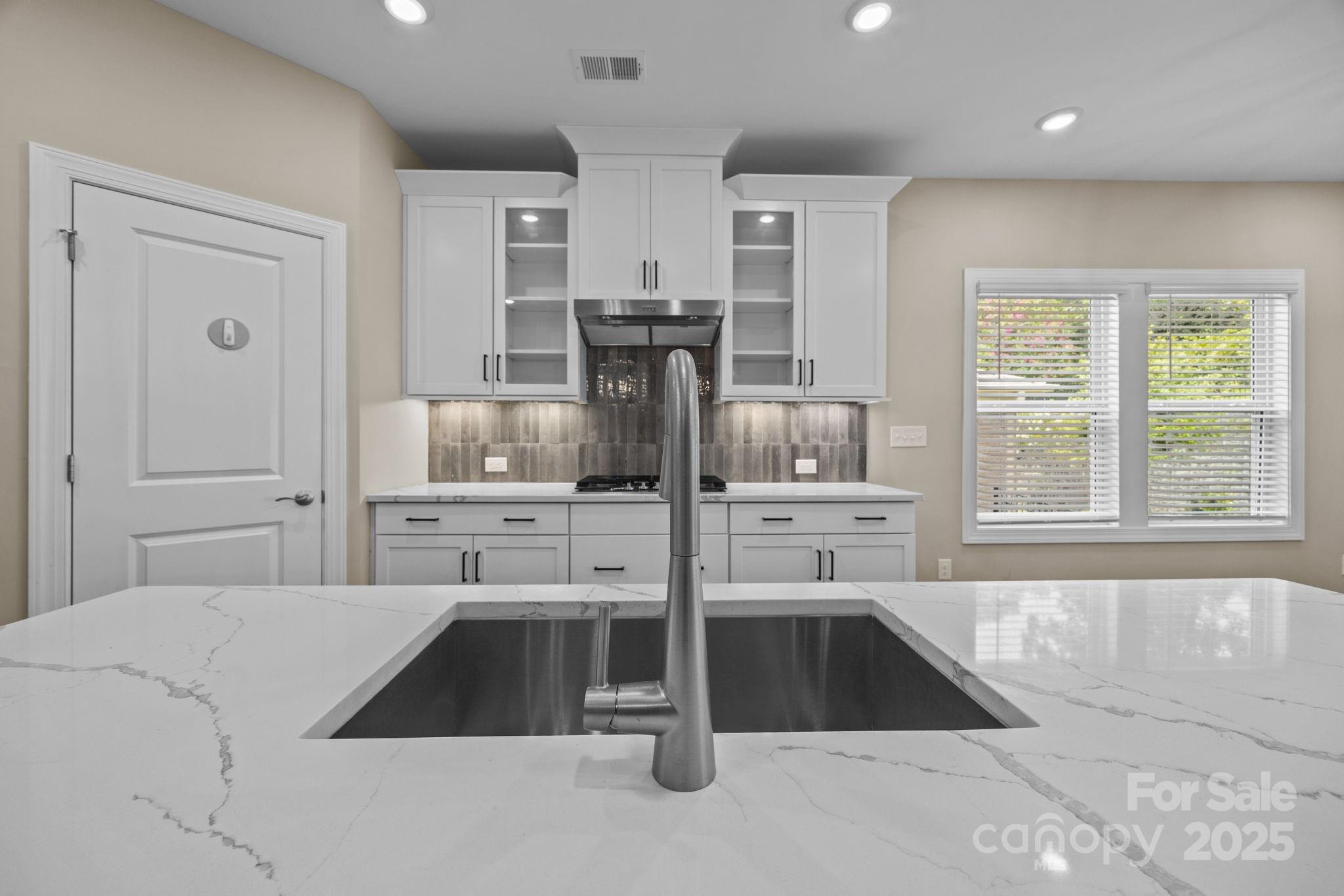 5240 Birchhill Road Mint Hill, NC 28227 - Photo 42 of 48 a kitchen with stainless steel appliances kitchen island granite countertop a refrigerator and a sink