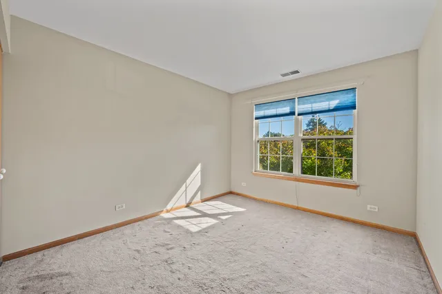 a view of a big room with windows