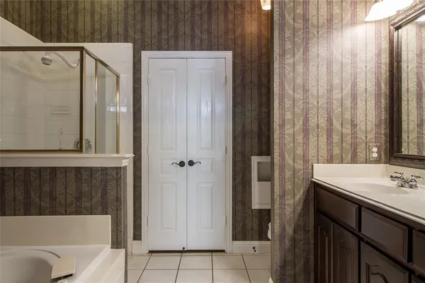 a bathroom with a sink a bathtub and a shower