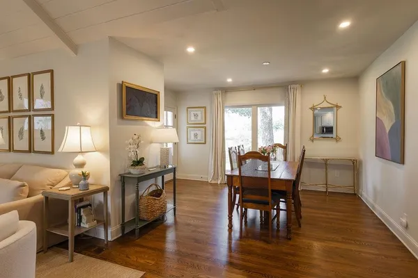 a view of a dining room with furniture window and wooden floor