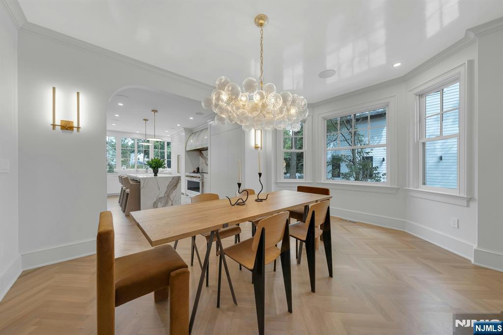 84 Watchung Avenue Montclair, NJ 07043 - Photo 11 of 48 a view of a dining room with furniture a chandelier and wooden floor