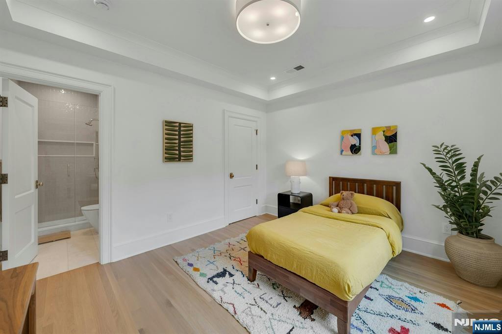 84 Watchung Avenue Montclair, NJ 07043 - Photo 23 of 48 a bedroom with a bed and a potted plant