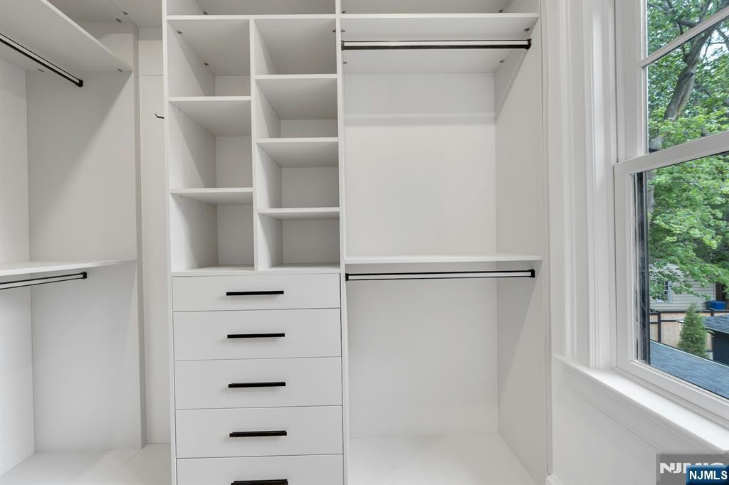 84 Watchung Avenue Montclair, NJ 07043 - Photo 30 of 48 a view of walk in closet with empty racks