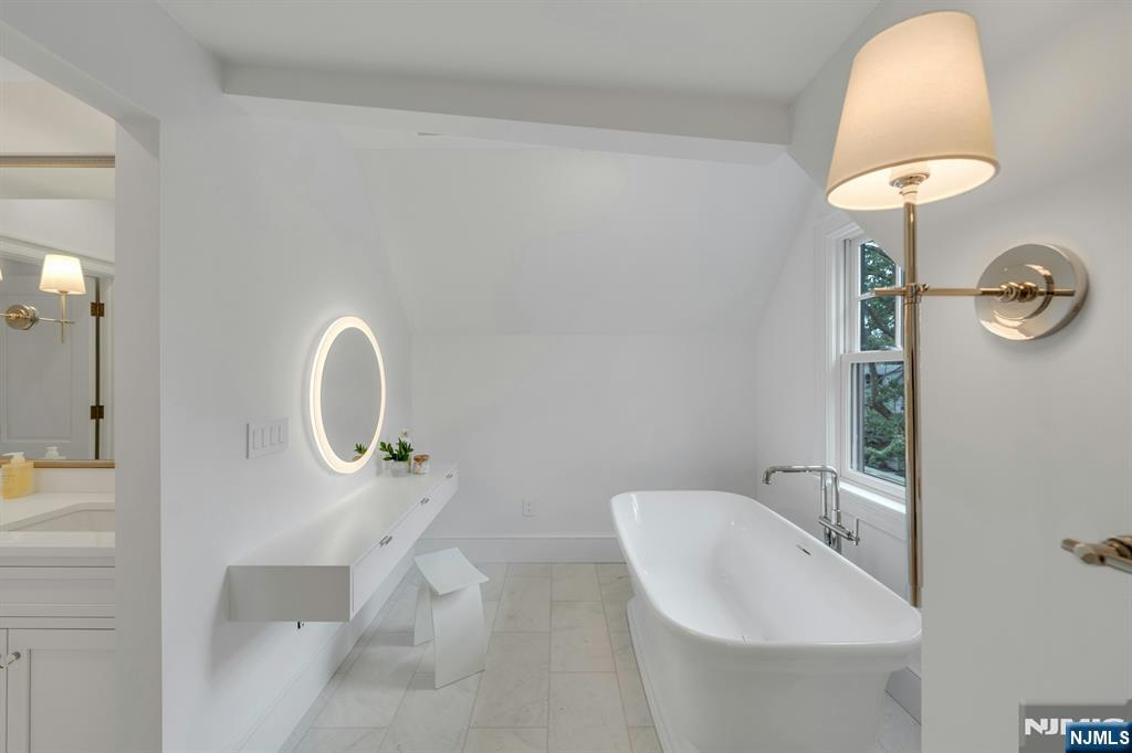 84 Watchung Avenue Montclair, NJ 07043 - Photo 35 of 48 a bathroom with a sink a toilet and a mirror