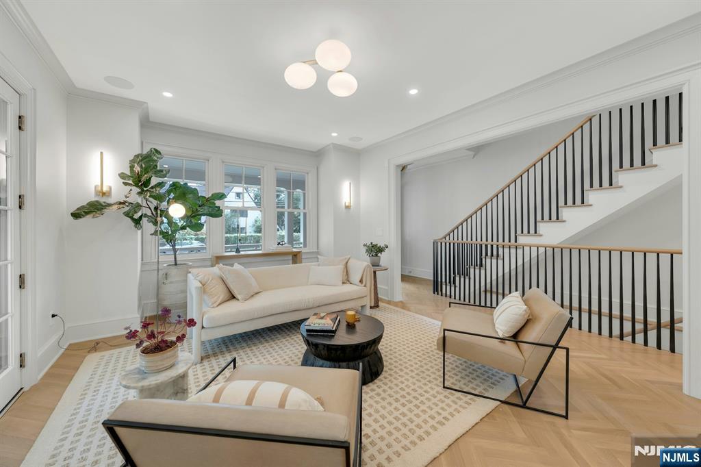 84 Watchung Avenue Montclair, NJ 07043 - Photo 6 of 48 a living room with furniture and a chandelier