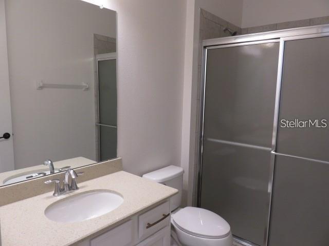 6915 Indus Valley Circle Parrish, FL 34219 - Photo 17 of 38 a bathroom with a sink toilet and shower