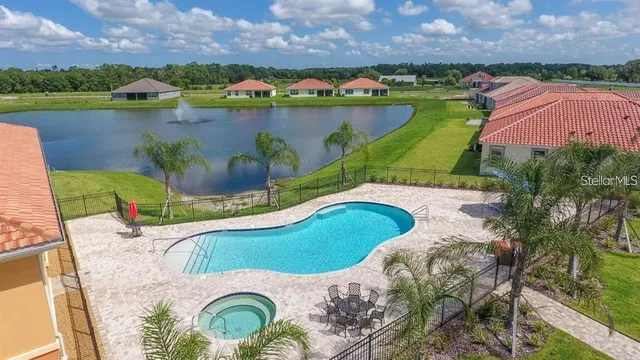 an aerial view of a house with a lake view