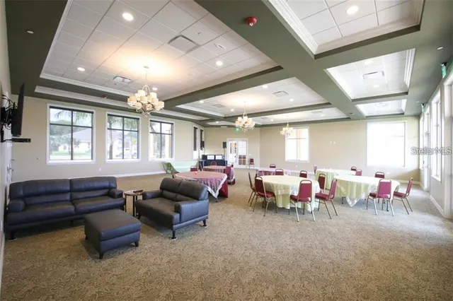 a living room with lots of furniture and a window