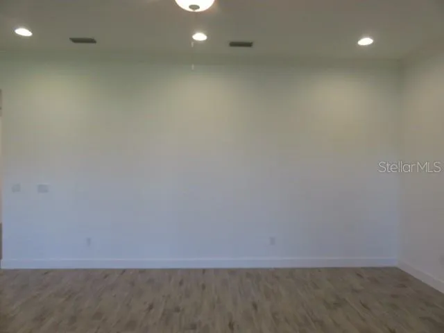 a view of room with hardwood floor