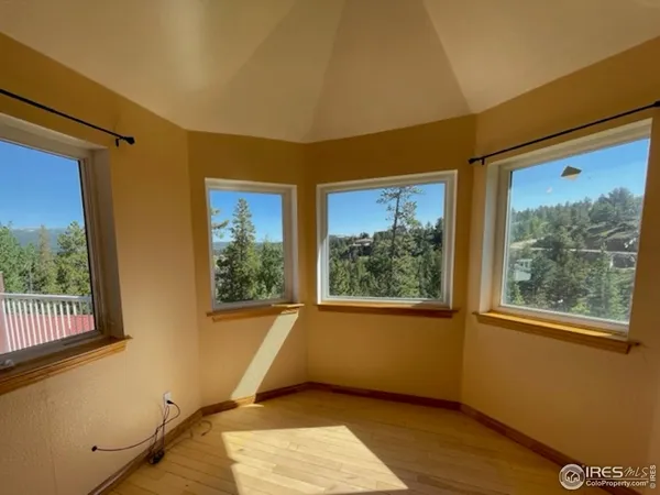 a view of a room with a large window