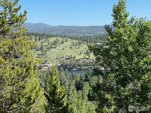 a view of lake with mountain in the background