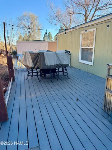 a view of outdoor space with wooden floor