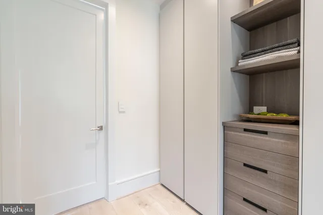 a bathroom with a glass shower door