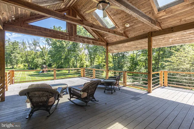 a view of swimming pool with outdoor seating