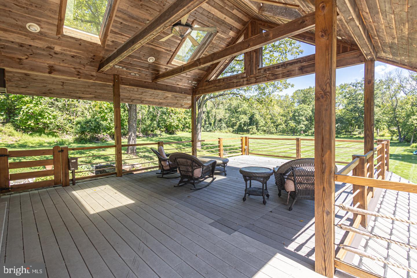 3111 Burnt House Hill Road Doylestown, PA 18902 - Photo 20 of 45 a view of a patio with chairs and wooden floor