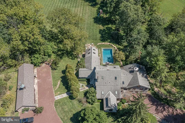an aerial view of a house with outdoor space