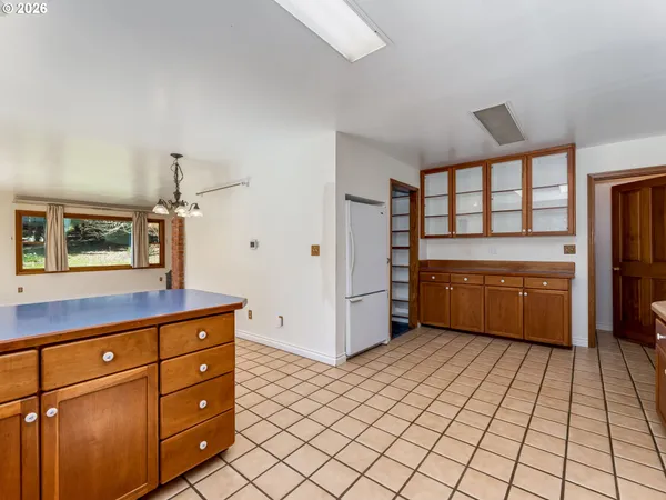 a kitchen with a cabinets and white appliances