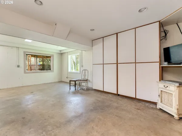 a view of a livingroom with furniture and a flat screen tv