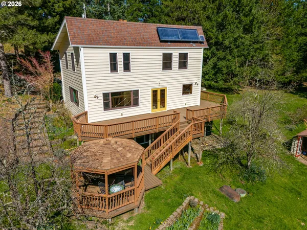 a aerial view of a house with a yard