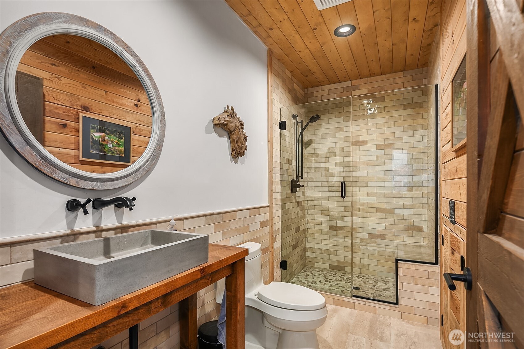31405 Redmond-Fall City Road Southeast Fall City, WA 98024 - Photo 15 of 32 a bathroom with a sink a toilet and a mirror