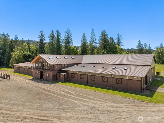 a view of a house with outdoor space and sitting area