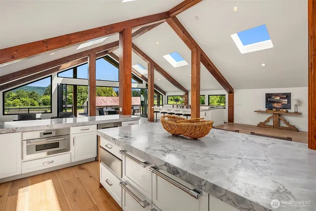 a kitchen with a large window and a sink