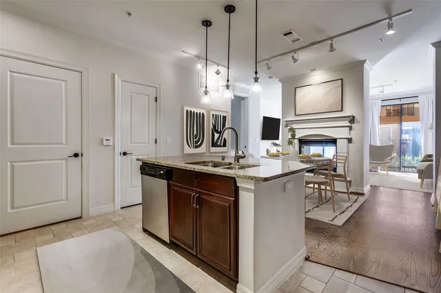 a kitchen with stainless steel appliances granite countertop a stove and a refrigerator