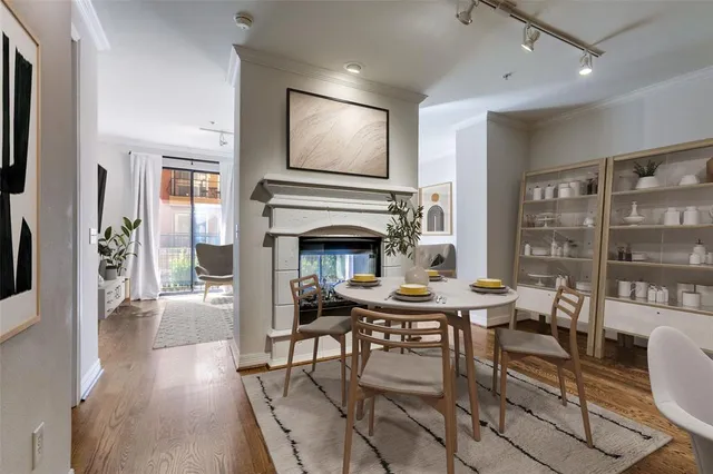 a view of a livingroom with furniture window and wooden floor