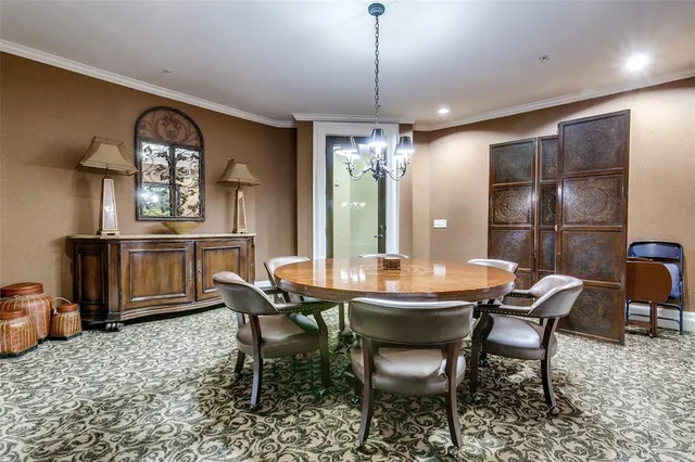 a dining room with furniture a chandelier and window