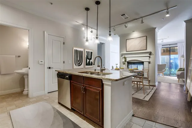 a kitchen with a sink stove and refrigerator