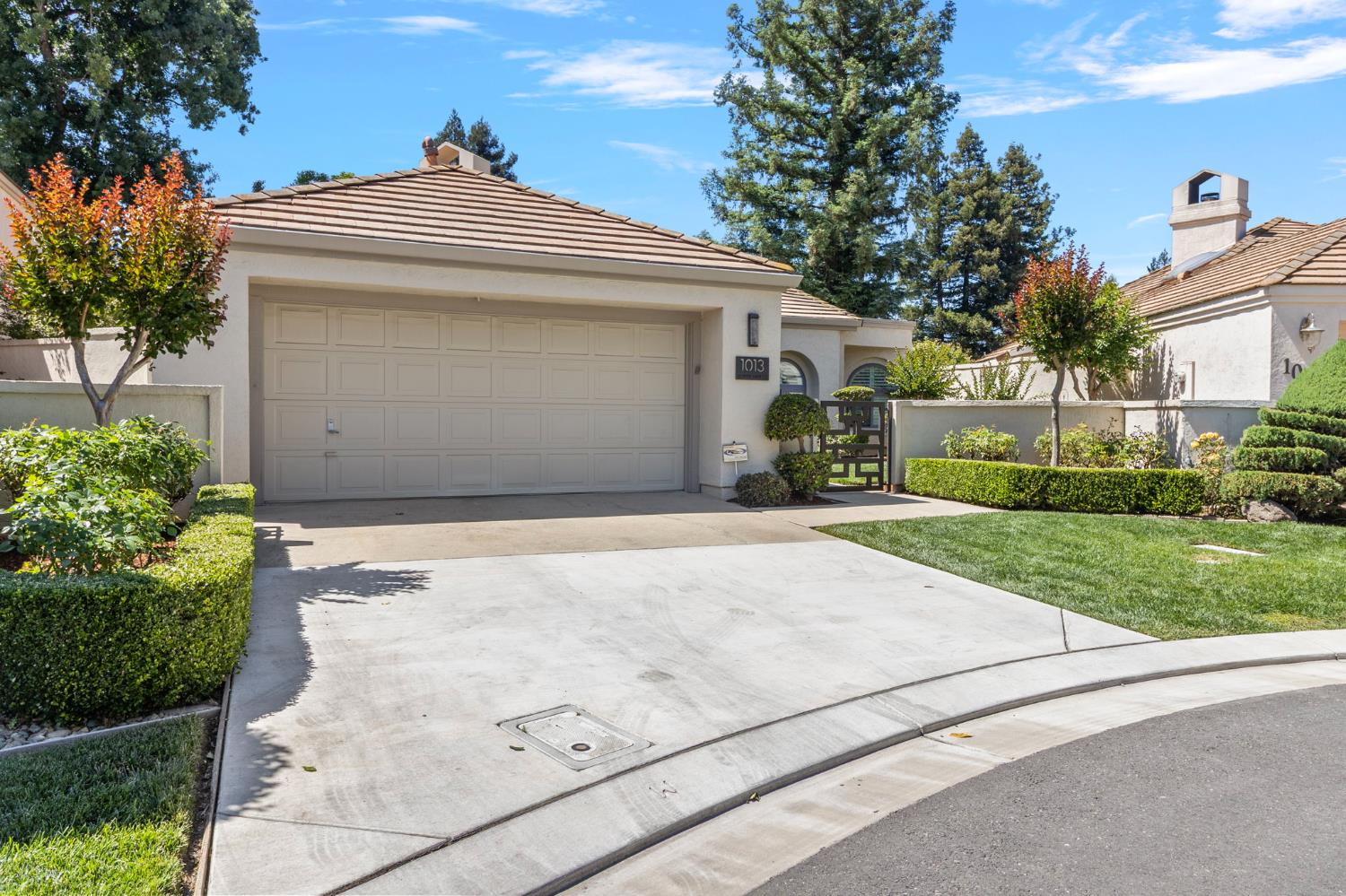 1013 Copper Lake Court Modesto, CA 95355 - Photo 30 of 66 front view of a house with a bench
