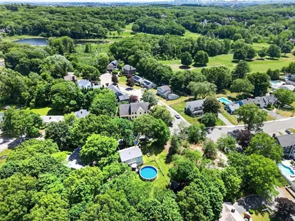 an aerial view of residential house with outdoor space and street view