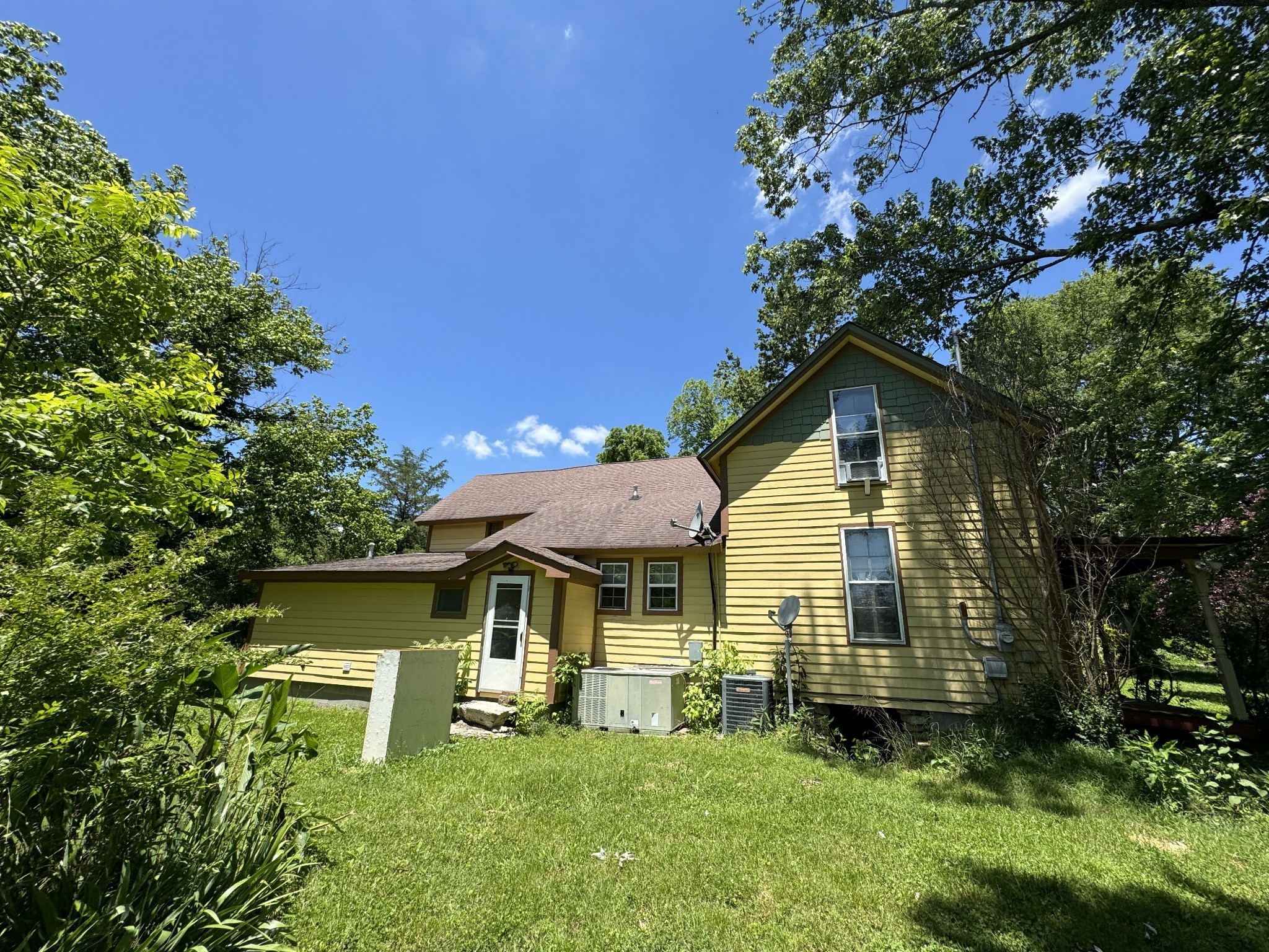 2342 Valley Creek Road Culleoka, TN 38451 - Photo 4 of 24 a front view of a house with a yard table and chairs