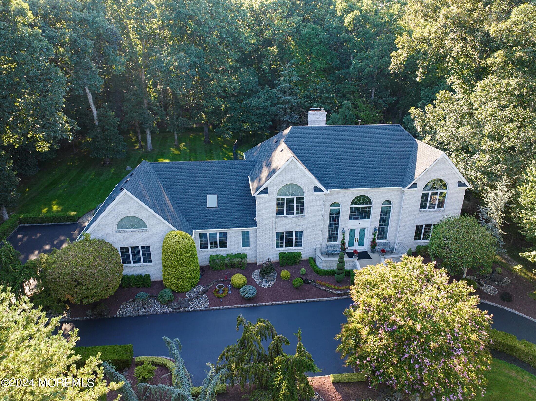 7 Wetherill Drive Millstone Township, NJ 08510 - Photo 1 of 93 a aerial view of a house next to a yard