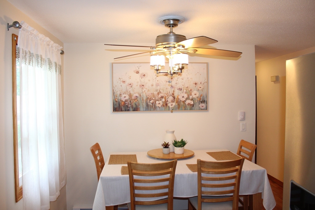 28 State Street Chicopee, MA 01013 - Photo 8 of 25 a view of a dining room with furniture and chandelier