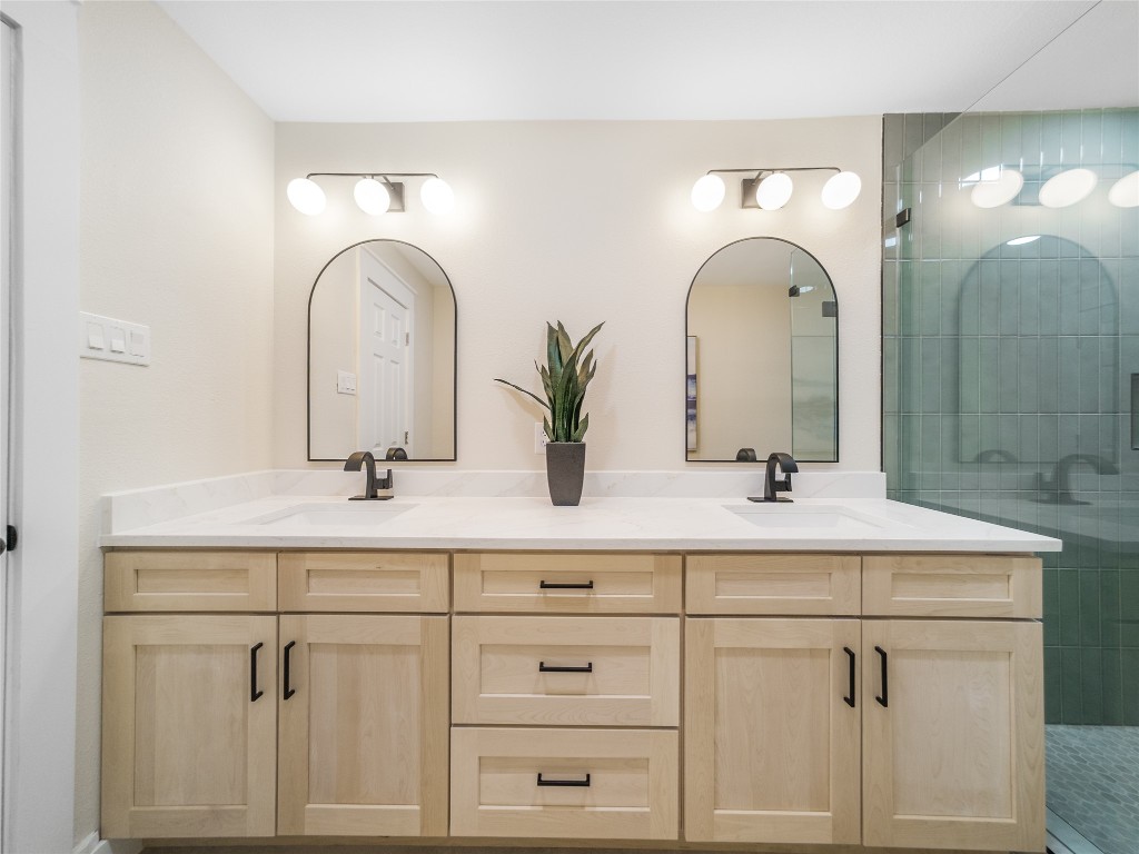 224 Clear Springs Road Georgetown, TX 78628 - Photo 23 of 32 Full bathroom featuring double vanity and tiled shower