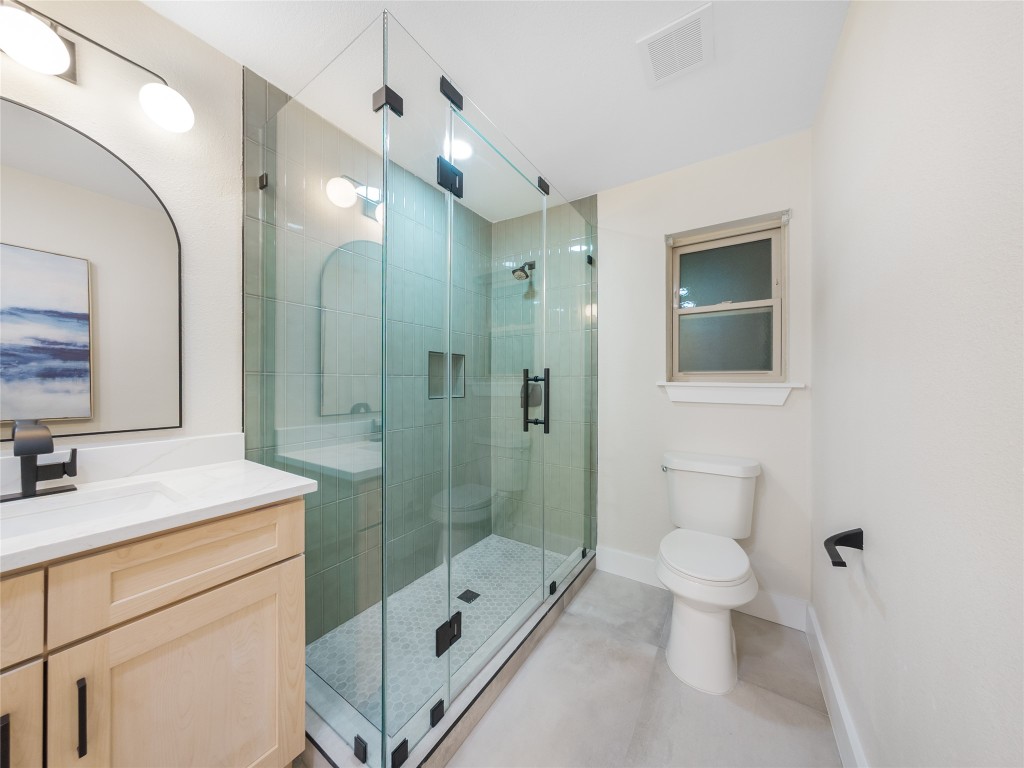 224 Clear Springs Road Georgetown, TX 78628 - Photo 24 of 32 Full bathroom featuring vanity, a shower stall, and tile patterned flooring