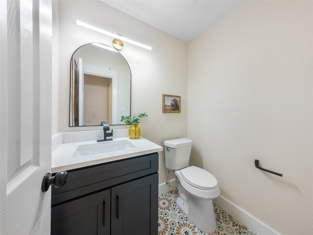 224 Clear Springs Road Georgetown, TX 78628 - Photo 26 of 32 Half bathroom with vanity and tile patterned flooring
