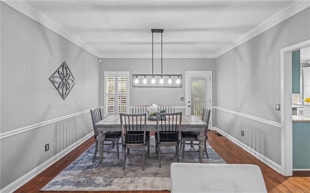 555 Douthit Ferry Road Cartersville, GA 30120 - Photo 12 of 36 a view of a dining room with furniture window and wooden floor
