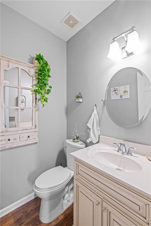 555 Douthit Ferry Road Cartersville, GA 30120 - Photo 23 of 36 a bathroom with a sink a toilet and mirror