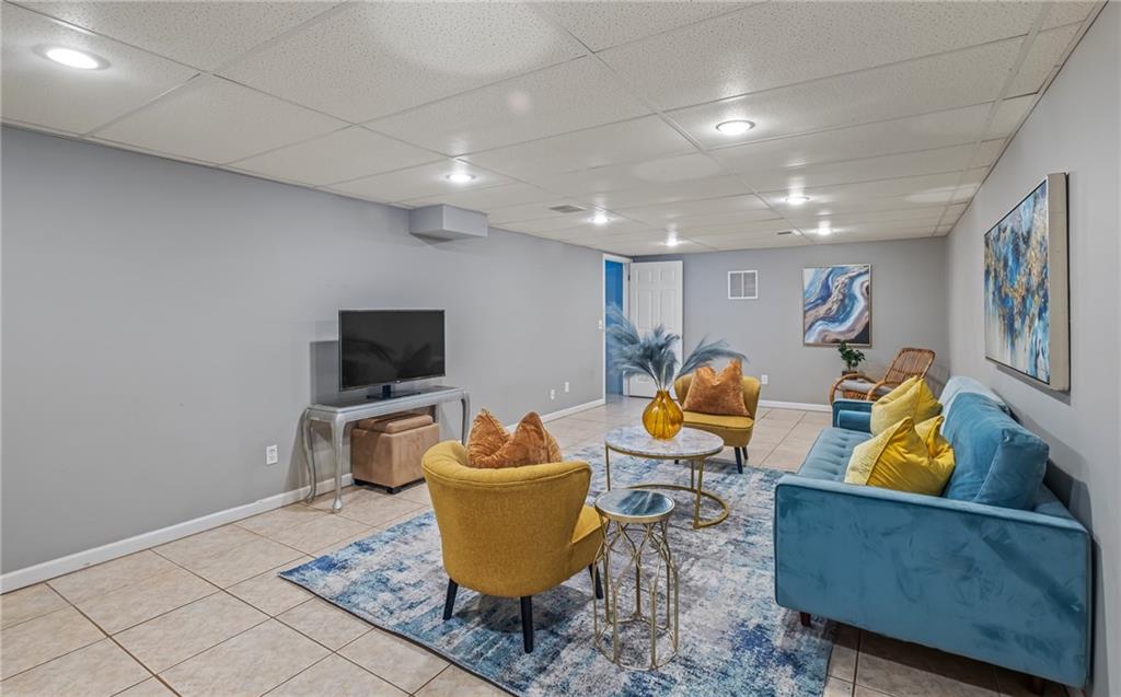 555 Douthit Ferry Road Cartersville, GA 30120 - Photo 31 of 36 a living room with furniture and a flat screen tv