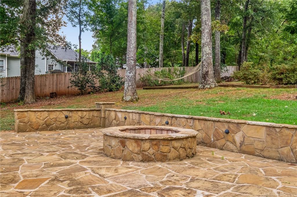 555 Douthit Ferry Road Cartersville, GA 30120 - Photo 33 of 36 a view of a swimming pool with a patio