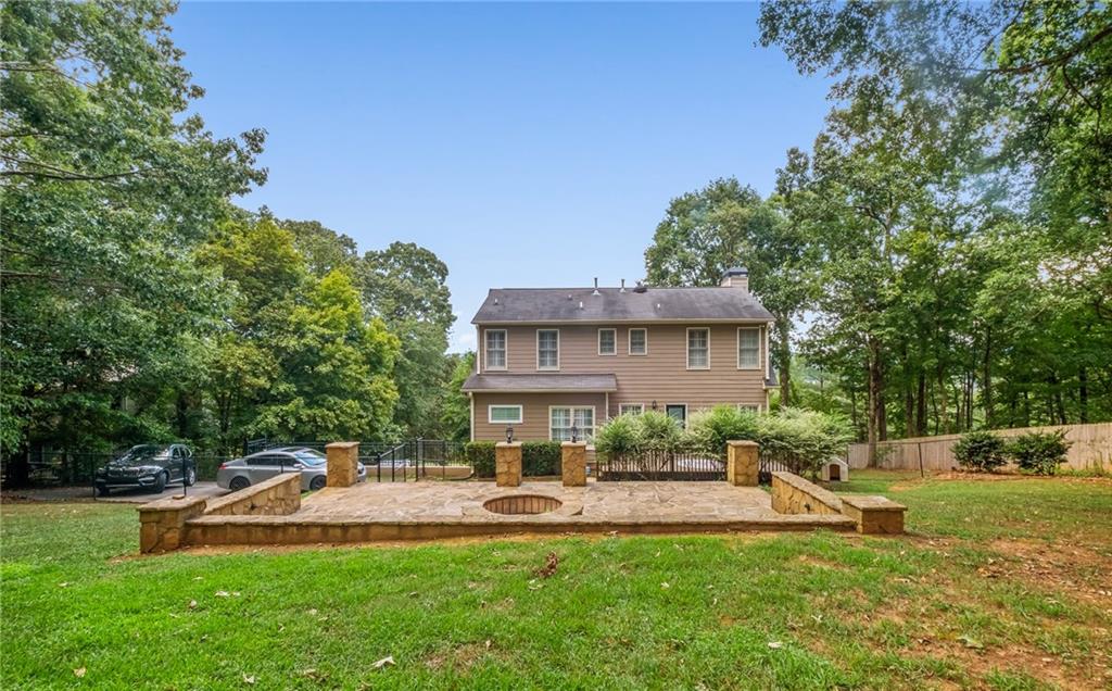 555 Douthit Ferry Road Cartersville, GA 30120 - Photo 36 of 36 a view of a house with a yard porch and sitting area